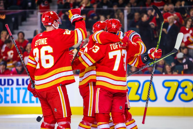 Nov 1, 2022; Calgary, Alberta, CAN; Calgary Flames right wing Tyler Toffoli (73) celebrates his goal with teammates against the Seattle Kraken during the third period at Scotiabank Saddledome. Mandatory Credit: Sergei Belski-USA TODAY Sports