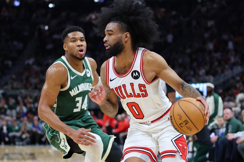 MILWAUKEE, WISCONSIN - OCTOBER 25: Coby White #0 of the Chicago Bulls drives around Giannis Antetokounmpo #34 of the Milwaukee Bucks during the first half of a game at Fiserv Forum on October 25, 2024 in Milwaukee, Wisconsin. NOTE TO USER: User expressly acknowledges and agrees that, by downloading and or using this photograph, User is consenting to the terms and conditions of the Getty Images License Agreement. (Photo by Stacy Revere/Getty Images)