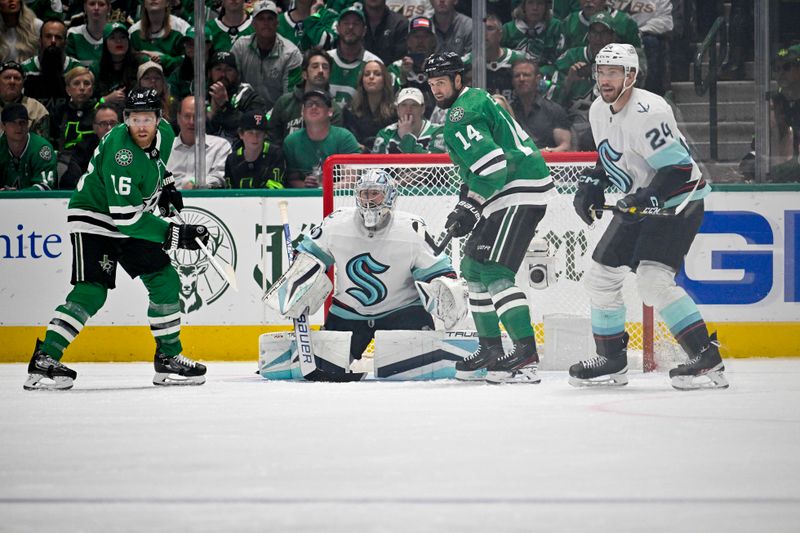 May 15, 2023; Dallas, Texas, USA; Dallas Stars center Joe Pavelski (16) and left wing Jamie Benn (14) and Seattle Kraken goaltender Philipp Grubauer (31) and defenseman Jamie Oleksiak (24) look for the puck in the Seattle zone during the first period in game seven of the second round of the 2023 Stanley Cup Playoffs at the American Airlines Center. Mandatory Credit: Jerome Miron-USA TODAY Sports