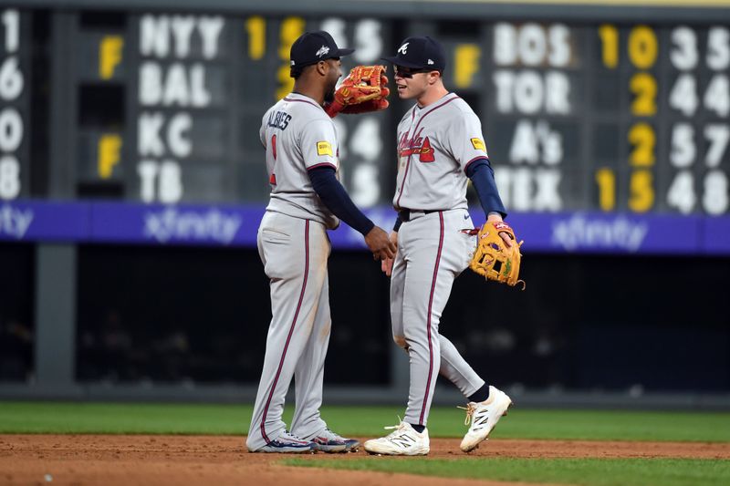 Apr 29, 2025; Denver, Colorado, USA; Atlanta Braves second base Ozzie Albies (1) and shortstop Nick Allen (2) celebrate after a win against the Colorado Rockies at Coors Field. Mandatory Credit: Christopher Hanewinckel-Imagn Images