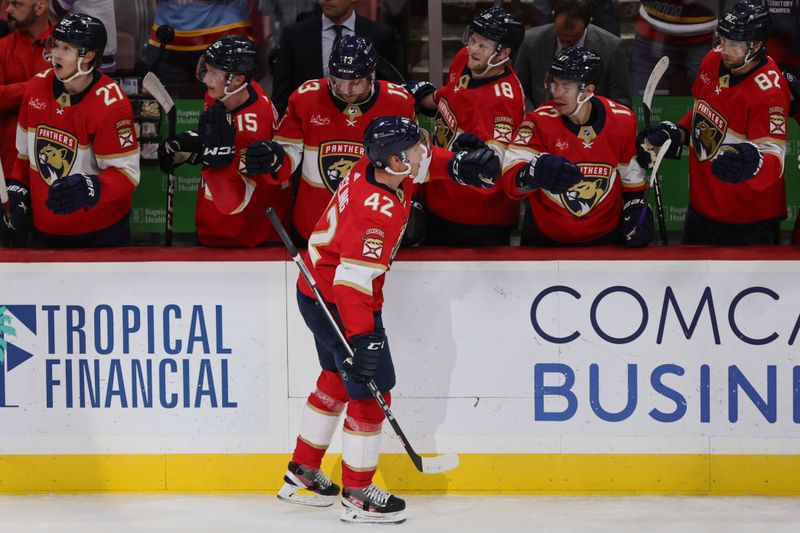 Jan 19, 2024; Sunrise, Florida, USA; Florida Panthers defenseman Gustav Forsling (42) celebrates with teammates after scoring against the Minnesota Wild during the third period at Amerant Bank Arena. Mandatory Credit: Sam Navarro-USA TODAY Sports