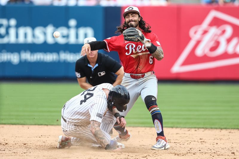 Jul 4, 2024; Bronx, New York, USA; Cincinnati Reds second baseman Jonathan India (6) throws past New York Yankees left fielder Alex Verdugo (24) attempting to complete a double play in the eighth inning at Yankee Stadium. Mandatory Credit: Wendell Cruz-USA TODAY Sports