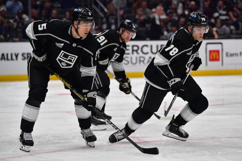 Dec 13, 2023; Los Angeles, California, USA; Los Angeles Kings defenseman Andreas Englund (5) right wing Carl Grundstrom (91) and right wing Alex Laferriere (78) against the Winnipeg Jets during the third period at Crypto.com Arena. Mandatory Credit: Gary A. Vasquez-USA TODAY Sports