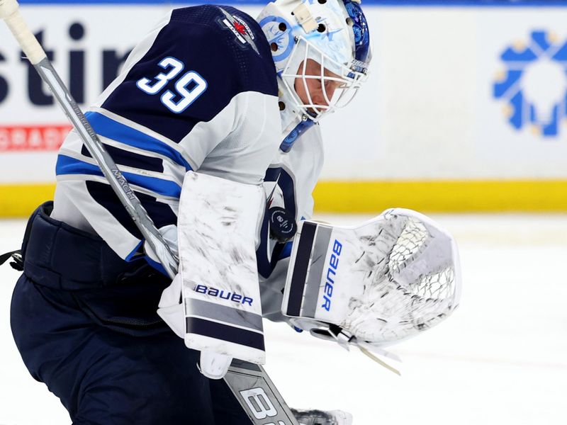 Mar 3, 2024; Buffalo, New York, USA;  Winnipeg Jets goaltender Laurent Brossoit (39) makes a save during the second period against the Buffalo Sabres at KeyBank Center. Mandatory Credit: Timothy T. Ludwig-USA TODAY Sports