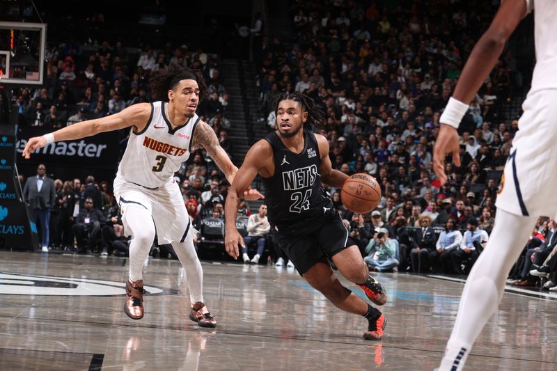 BROOKLYN, NY - OCTOBER 29: Cam Thomas #24 of the Brooklyn Nets handles the ball during the game against the Denver Nuggets on October 29, 2024 at Barclays Center in Brooklyn, New York. NOTE TO USER: User expressly acknowledges and agrees that, by downloading and or using this Photograph, user is consenting to the terms and conditions of the Getty Images License Agreement. Mandatory Copyright Notice: Copyright 2024 NBAE (Photo by Nathaniel S. Butler/NBAE via Getty Images)