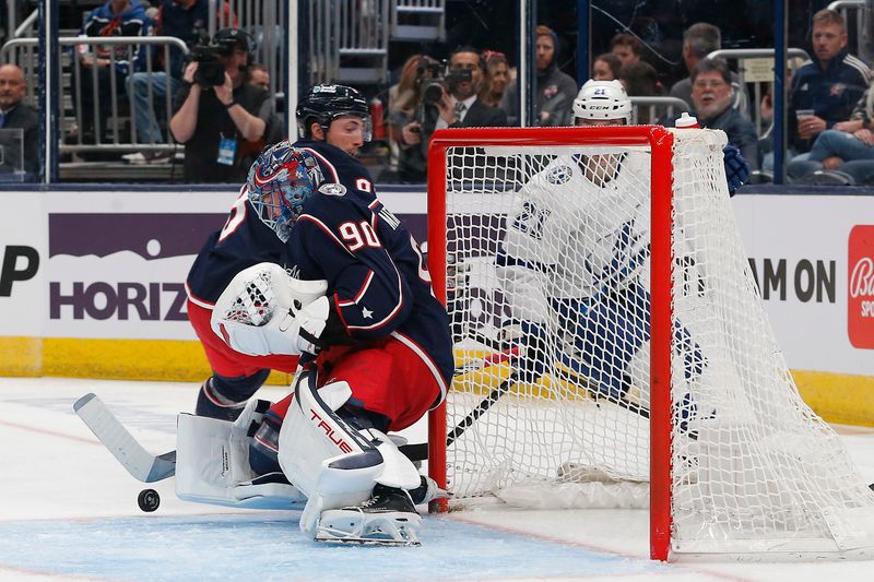 Feb 10, 2024; Columbus, Ohio, USA; Columbus Blue Jackets goalie Elvis Merzlikins (90) makes a save on the shot from Tampa Bay Lightning center Brayden Point (21) during the first period at Nationwide Arena. Mandatory Credit: Russell LaBounty-USA TODAY Sports