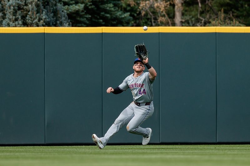 Aug 8, 2024; Denver, Colorado, USA; New York Mets center fielder Harrison Bader (44) makes a catch in the eighth inning against the Colorado Rockies at Coors Field. Mandatory Credit: Isaiah J. Downing-USA TODAY Sports