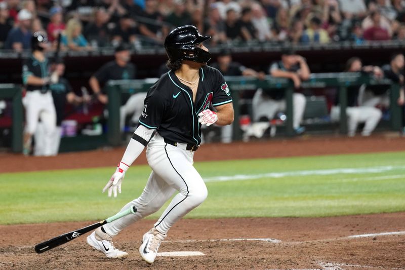 Jul 12, 2024; Phoenix, Arizona, USA; Arizona Diamondbacks outfielder Alek Thomas (5) hits a two RBI single against the Toronto Blue Jays during the eighth inning at Chase Field. Mandatory Credit: Joe Camporeale-USA TODAY Sports