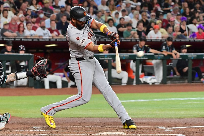 Sep 23, 2024; Phoenix, Arizona, USA;  San Francisco Giants outfielder Jerar Encarnacion (59) hits a RBI double in the third inning against the Arizona Diamondbacks at Chase Field. Mandatory Credit: Matt Kartozian-Imagn Images