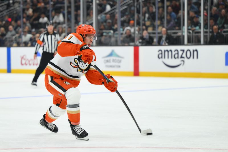 Oct 9, 2025; Seattle, Washington, USA; Anaheim Ducks defenseman Olen Zellweger (51) shoots the puck against the Seattle Kraken during the first period at Climate Pledge Arena. Mandatory Credit: Steven Bisig-Imagn Images