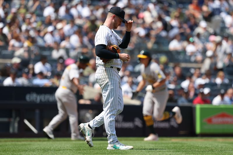 Jun 28, 2025; Bronx, New York, USA; Athletics pitcher Hogan Harris (36) reacts after a three run home run by Athletics first base Nick Kurtz (16) during the sixth inning at Yankee Stadium. Mandatory Credit: Vincent Carchietta-Imagn Images