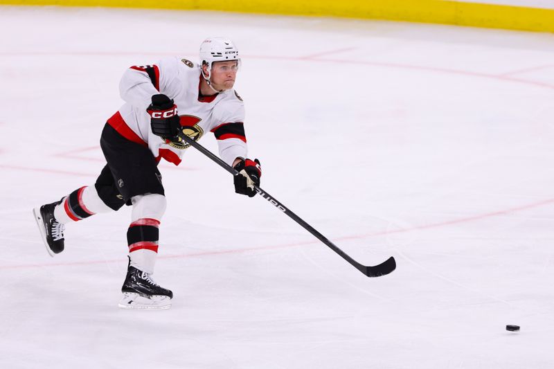 Apr 9, 2024; Sunrise, Florida, USA; Ottawa Senators defenseman Jakob Chychrun (6) moves the puck against the Florida Panthers during the third period at Amerant Bank Arena. Mandatory Credit: Sam Navarro-USA TODAY Sports