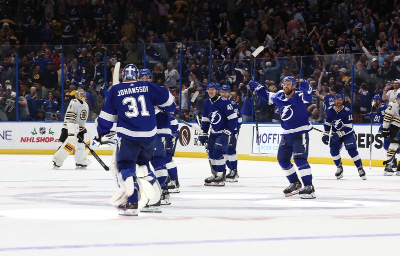 Nov 20, 2023; Tampa, Florida, USA; Tampa Bay Lightning goaltender Jonas Johansson (31) and his teammates celebrate after they defeat the Boston Bruins during overtime at Amalie Arena. Mandatory Credit: Kim Klement Neitzel-USA TODAY Sports