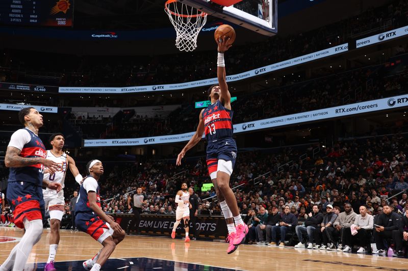 WASHINGTON, DC -? JANUARY 16: Jordan Poole #13 of the Washington Wizards drives to the basket during the game against the Phoenix Suns on January 16, 2025 at Capital One Arena in Washington, DC. NOTE TO USER: User expressly acknowledges and agrees that, by downloading and or using this Photograph, user is consenting to the terms and conditions of the Getty Images License Agreement. Mandatory Copyright Notice: Copyright 2024 NBAE (Photo by Kenny Giarla/NBAE via Getty Images)