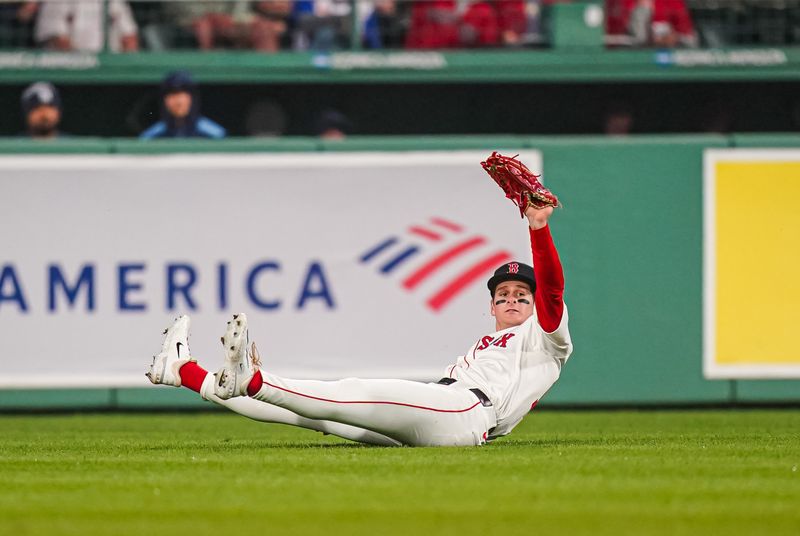 Jun 10, 2025; Boston, Massachusetts, USA; Boston Red Sox outfielder Josh Lowe (15) makes the catch against the Tampa Bay Rays in the sixth inning at Fenway Park. Mandatory Credit: David Butler II-Imagn Images