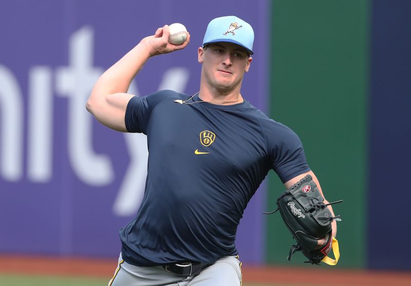 May 23, 2025; Pittsburgh, Pennsylvania, USA;  Milwaukee Brewers pitcher Quinn Priester (46) throws in the outfield before the game the Pittsburgh Pirates against at PNC Park. Mandatory Credit: Charles LeClaire-Imagn Images