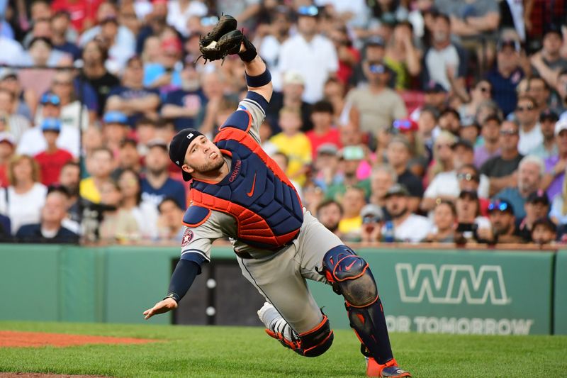 Aug 10, 2024; Boston, Massachusetts, USA;  Houston Astros catcher Victor Caratini (17) makes a catch for an out during the ninth inning against the Boston Red Sox at Fenway Park. Mandatory Credit: Bob DeChiara-USA TODAY Sports