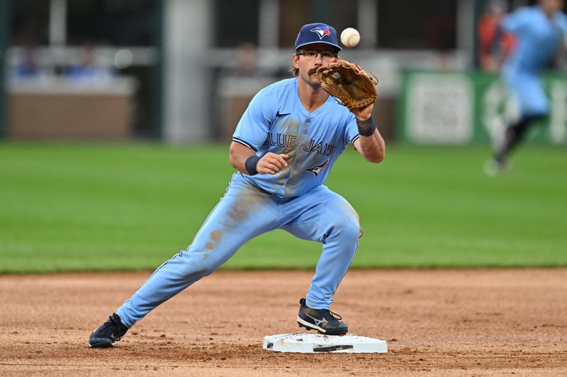 May 28, 2024; Chicago, Illinois, USA;  Toronto Blue Jays infielder Davis Schneider (36) takes a throw at second base to begin a double play in the first inning against the Chicago White Sox at Guaranteed Rate Field. Mandatory Credit: Jamie Sabau-USA TODAY Sports