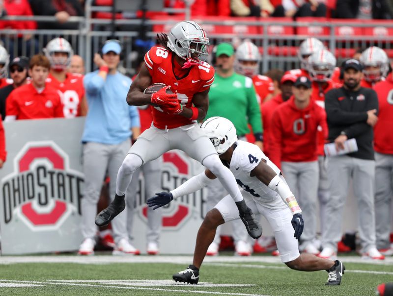 Oct 21, 2023; Columbus, Ohio, USA;  Ohio State Buckeyes wide receiver Marvin Harrison Jr. (18) catches the football against Penn State Nittany Lions cornerback Kalen King (4) during the third quarter at Ohio Stadium. Mandatory Credit: Joseph Maiorana-USA TODAY Sports