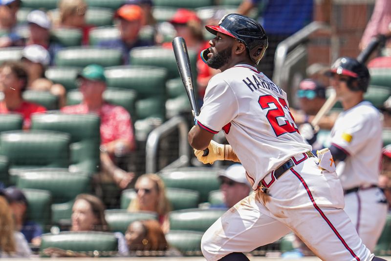 Apr 23, 2025; Cumberland, Georgia, USA; Atlanta Braves outfielder Michael Harris II (23) singles to drive in a run against the St. Louis Cardinals during the seventh inning at Truist Park. Mandatory Credit: Dale Zanine-Imagn Images