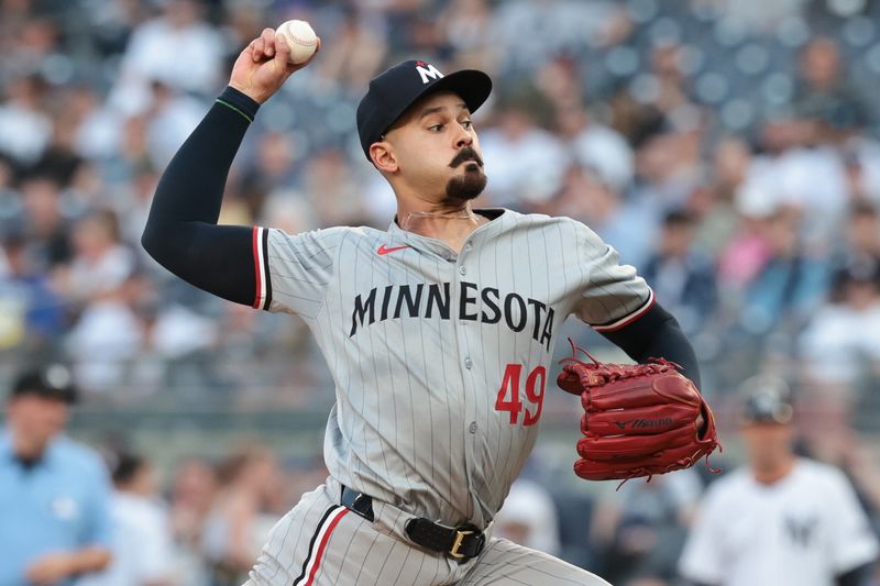 Jun 6, 2024; Bronx, New York, USA; Minnesota Twins starting pitcher Pablo Lopez (49) delivers a pitch during the first inning against the New York Yankees at Yankee Stadium. Mandatory Credit: Vincent Carchietta-USA TODAY Sports