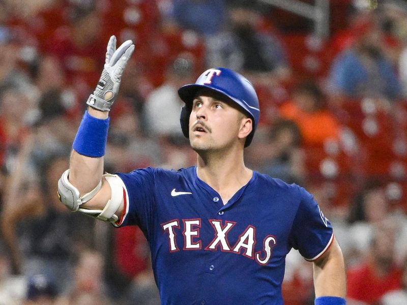 Jul 29, 2024; St. Louis, Missouri, USA;  Texas Rangers first baseman Nathaniel Lowe (30) reacts after hitting a two run home run against the St. Louis Cardinals during the seventh inning at Busch Stadium. Mandatory Credit: Jeff Curry-USA TODAY Sports