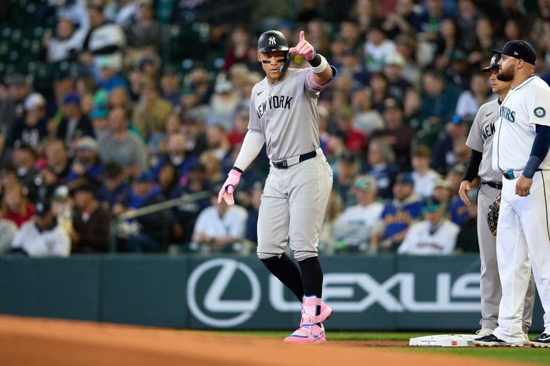 May 14, 2025; Seattle, Washington, USA; New York Yankees designated hitter Aaron Judge (99) stands on first after his single against the Seattle Mariners during the first inning at T-Mobile Park. Mandatory Credit: John Froschauer-Imagn Images