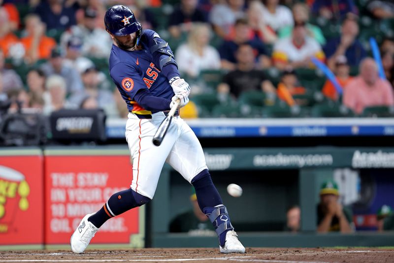 Jul 27, 2025; Houston, Texas, USA;Houston Astros first baseman Christian Walker (8) hits a single against the Athletics during the second inning at Daikin Park. Mandatory Credit: Erik Williams-Imagn Images
