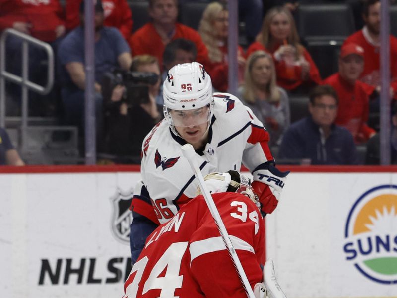 Apr 9, 2024; Detroit, Michigan, USA; Detroit Red Wings goaltender Alex Lyon (34) makes a save on Washington Capitals right wing Nicolas Aube-Kubel (96)ref10 in the first period at Little Caesars Arena. Mandatory Credit: Rick Osentoski-USA TODAY Sports