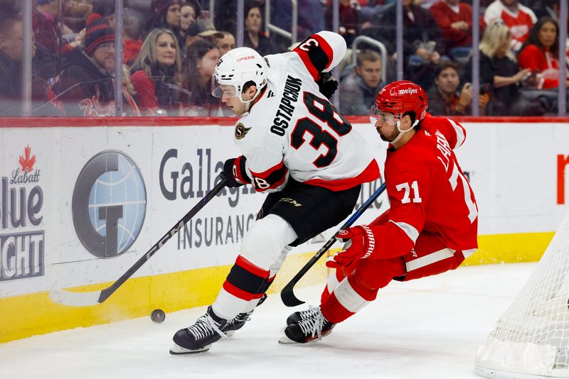 Jan 7, 2025; Detroit, Michigan, USA; Ottawa Senators center Zack Ostapchuk (38) and Detroit Red Wings center Dylan Larkin (71) battle for the puck in the second period at Little Caesars Arena. Mandatory Credit: Rick Osentoski-Imagn Images