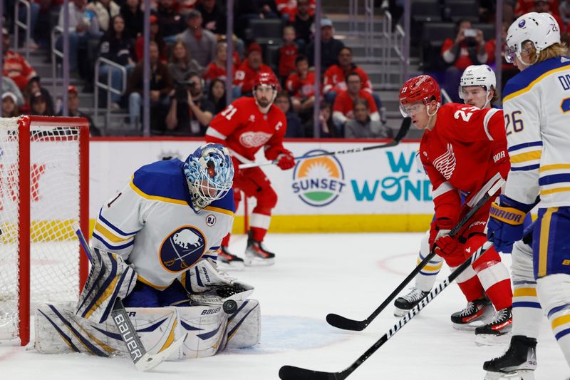 Apr 7, 2024; Detroit, Michigan, USA; Buffalo Sabres goaltender Ukko-Pekka Luukkonen (1) makes a save in front of Detroit Red Wings left wing Lucas Raymond (23) in the second period at Little Caesars Arena. Mandatory Credit: Rick Osentoski-USA TODAY Sports