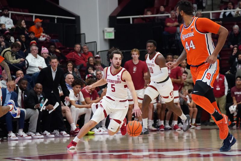 Jan 29, 2025; Stanford, California, USA;  Stanford Cardinal guard Benny Gealer (5) dribbles up court against Syracuse Orange center Eddie Lampkin Jr. (44) during the first half at Maples Pavilion. Mandatory Credit: David Gonzales-Imagn Images