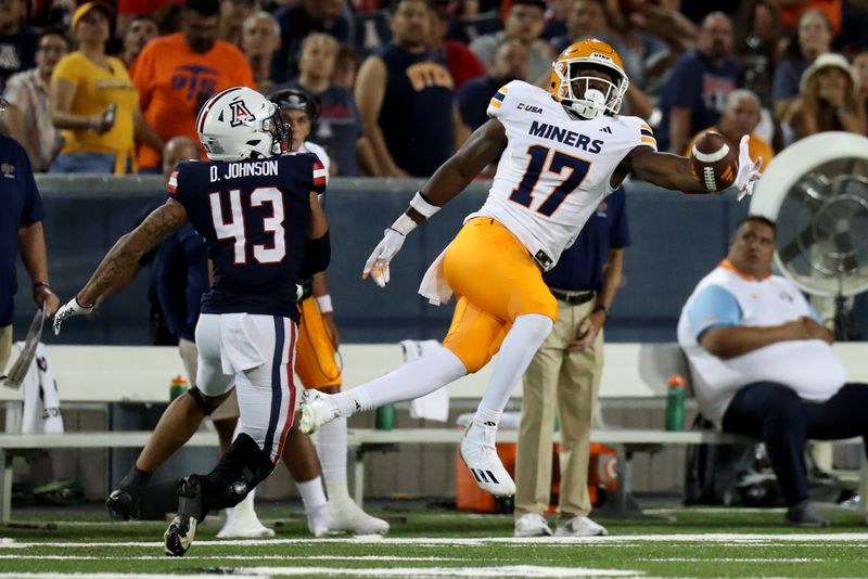 Sep 16, 2023; Tucson, Arizona, USA; UTEP Miners tight end Judah Ezinwa (17) drops a pass against Arizona Wildcats safety Dalton Johnson (43) during the second half at Arizona Stadium. Mandatory Credit: Zachary BonDurant-USA TODAY Sports