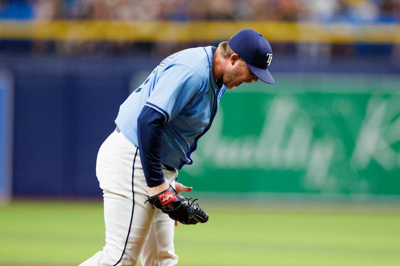 Jun 30, 2024; St. Petersburg, Florida, USA;  Tampa Bay Rays pitcher Garrett Cleavinger (60) reacts after pitching against the Washington Nationals in the eighth inning at Tropicana Field. Mandatory Credit: Nathan Ray Seebeck-USA TODAY Sports