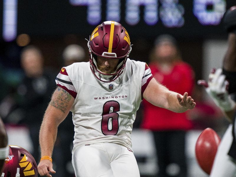 Washington Commanders place kicker Joey Slye (6) kicks during the first half of an NFL football game against the Atlanta Falcons, Sunday, Oct. 15, 2023, in Atlanta. The Washington Commanders won 24-16. (AP Photo/Danny Karnik)