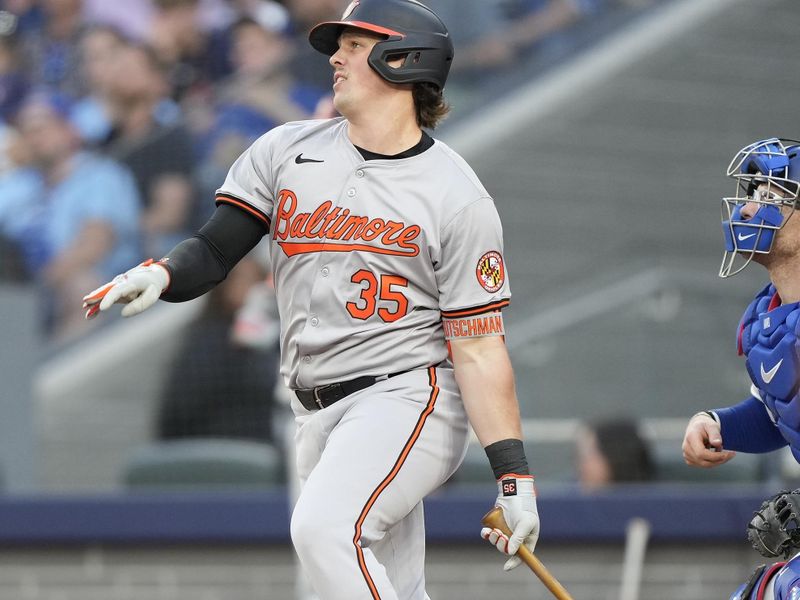 Jun 4, 2024; Toronto, Ontario, CAN;  Baltimore Orioles designated hitter Adley Rutschman (35) hits a RBI single against the Toronto Blue Jays during the third inning at Rogers Centre. Mandatory Credit: John E. Sokolowski-USA TODAY Sports