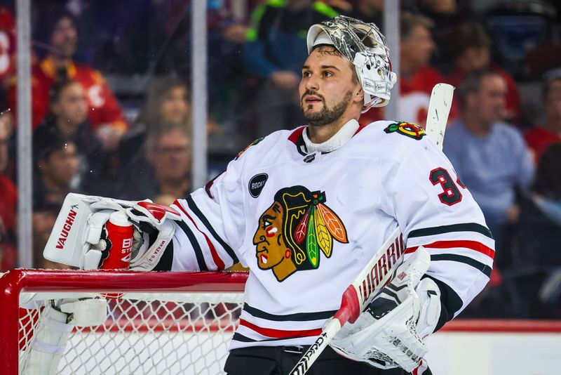 Jan 27, 2024; Calgary, Alberta, CAN; Chicago Blackhawks goaltender Petr Mrazek (34) reacts during the second period against the Calgary Flames at Scotiabank Saddledome. Mandatory Credit: Sergei Belski-USA TODAY Sports