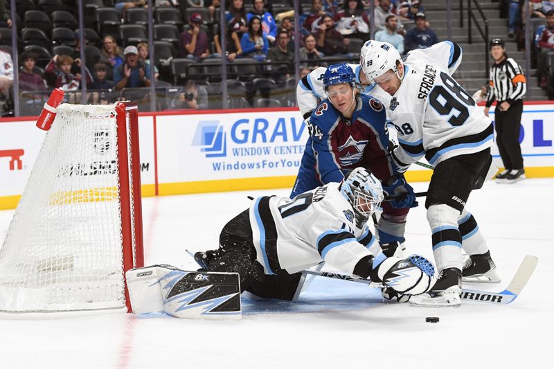 Sep 29, 2024; Denver, Colorado, USA; Utah Hockey Club goalie Karel Vejmelka (70) makes a save during the second period against the Colorado Avalanche at Ball Arena. Mandatory Credit: Christopher Hanewinckel-Imagn Images