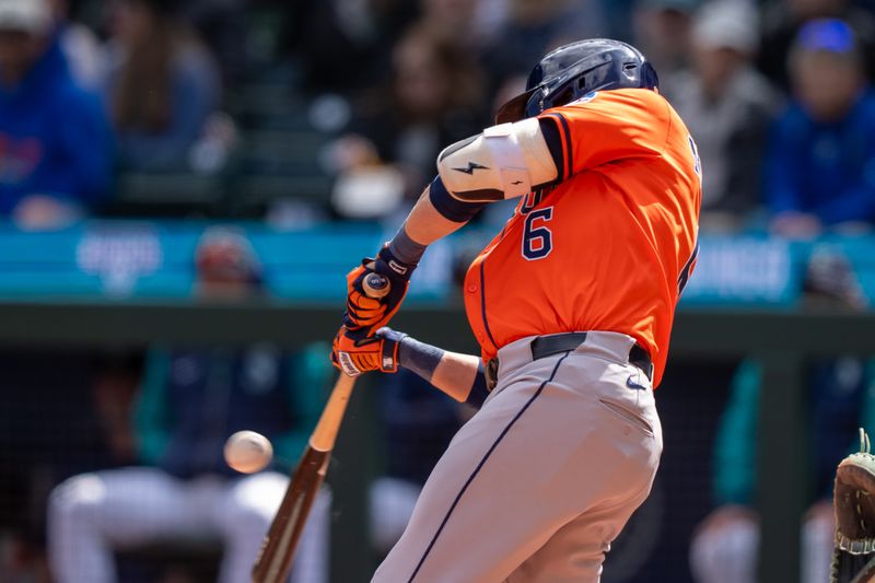 Apr 9, 2025; Seattle, Washington, USA;  Houston Astros centerfielder Jake Meyers (6) hits a RBI-single during the second inning against the Seattle Mariners at T-Mobile Park. Mandatory Credit: Stephen Brashear-Imagn Images
