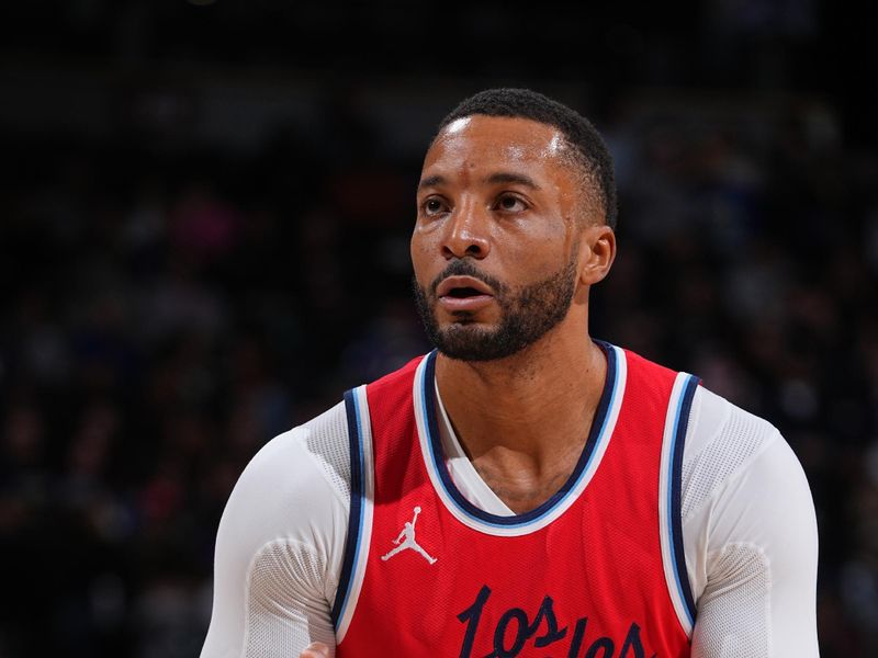 DENVER, CO - DECEMBER 13: Norman Powell #24 of the LA Clippers shoots a free throw during the game against the Denver Nuggets on December 13, 2024 at Ball Arena in Denver, Colorado. NOTE TO USER: User expressly acknowledges and agrees that, by downloading and/or using this Photograph, user is consenting to the terms and conditions of the Getty Images License Agreement. Mandatory Copyright Notice: Copyright 2024 NBAE (Photo by Garrett Ellwood/NBAE via Getty Images)