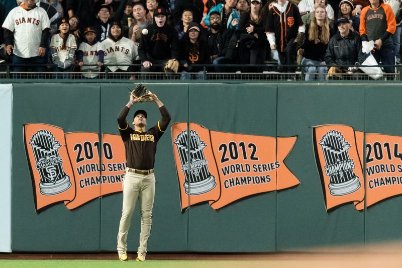 Sep 27, 2023; San Francisco, California, USA; San Diego Padres left fielder Juan Soto (22) catches a deep fly ball against the San Francisco Giants during the third inning at Oracle Park. Mandatory Credit: John Hefti-USA TODAY Sports