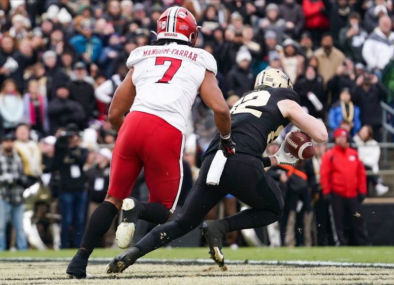 Nov 25, 2023; West Lafayette, Indiana, USA; Purdue Boilermakers tight end Drew Biber (82) catches a pass for a touchdown in front of Indiana Hoosiers linebacker Jacob Mangum-Farrar (7) during the first half at Ross-Ade Stadium. Mandatory Credit: Robert Goddin-USA TODAY Sports