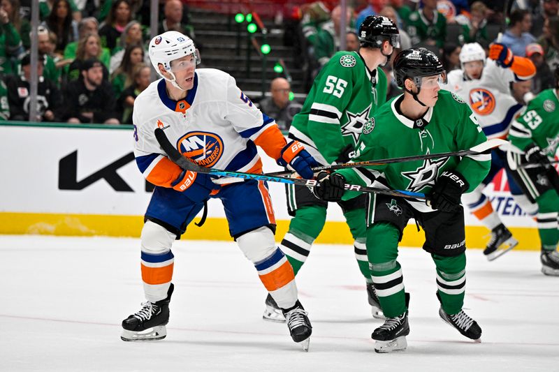 Oct 12, 2024; Dallas, Texas, USA; New York Islanders center Casey Cizikas (53) and Dallas Stars defenseman Nils Lundkvist (5) look for the puck in the Stars zone during the third period at the American Airlines Center. Mandatory Credit: Jerome Miron-Imagn Images