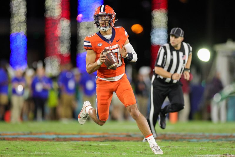 Dec 21, 2023; Boca Raton, FL, USA;  Syracuse Orange quarterback Braden Davis (10) looks to pass the ball against the South Florida Bulls in the second quarter during the RoofClaim.com Boca Raton Bowl at FAU Stadium. Mandatory Credit: Nathan Ray Seebeck-USA TODAY Sports