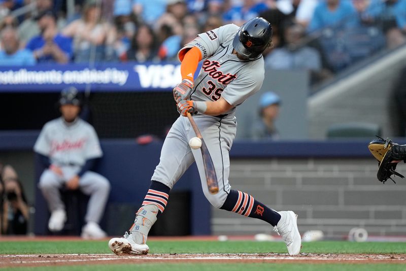 Jul 19, 2024; Toronto, Ontario, CAN; Detroit Tigers shortstop Zach McKinstry (39)  breaks his bat as he makes contact with the ball during the second inning at Rogers Centre. Mandatory Credit: John E. Sokolowski-USA TODAY Sports