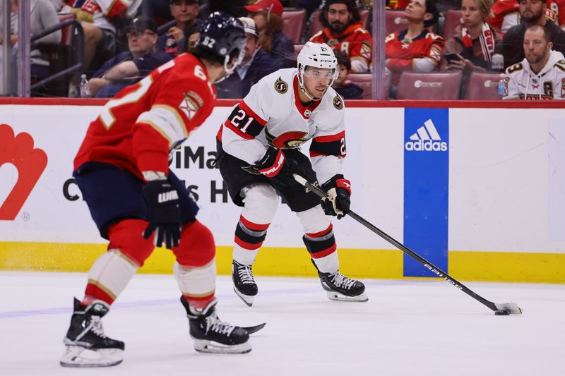 Apr 9, 2024; Sunrise, Florida, USA; Ottawa Senators right wing Mathieu Joseph (21) moves the puck against the Florida Panthers during the second period at Amerant Bank Arena. Mandatory Credit: Sam Navarro-USA TODAY Sports