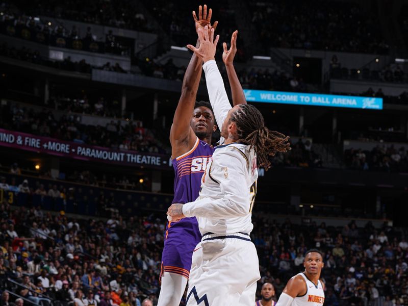 DENVER, CO - OCTOBER 13: Mamadi Diakite #25 of the Phoenix Suns drives to the basket during the game against the Denver Nuggets on October 13, 2024 at Ball Arena in Denver, Colorado. NOTE TO USER: User expressly acknowledges and agrees that, by downloading and/or using this Photograph, user is consenting to the terms and conditions of the Getty Images License Agreement. Mandatory Copyright Notice: Copyright 2024 NBAE (Photo by Garrett Ellwood/NBAE via Getty Images)