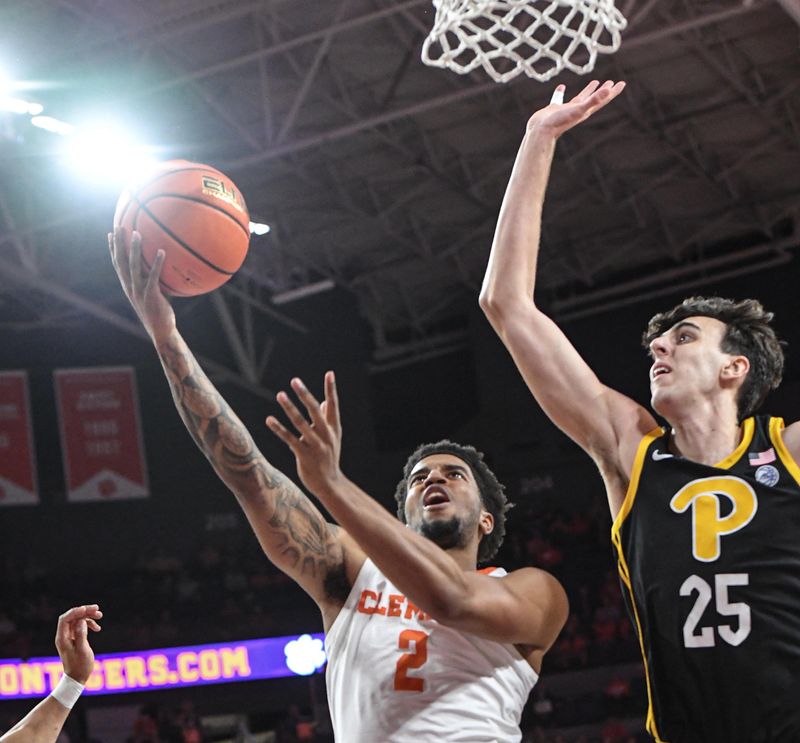 Feb 27, 2024; Clemson, South Carolina, USA;  Clemson sophomore guard Dillon Hunter (2) takes a shot near Pitt forward Guillermo Diaz Graham (25) during the first half at Littlejohn Coliseum. Mandatory Credit: Ken Ruinard-USA TODAY Sports