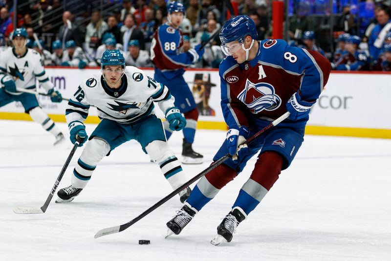 Mar 6, 2025; Denver, Colorado, USA; Colorado Avalanche defenseman Cale Makar (8) controls the puck ahead of San Jose Sharks left wing William Eklund (72) in the first period at Ball Arena. Mandatory Credit: Isaiah J. Downing-Imagn Images