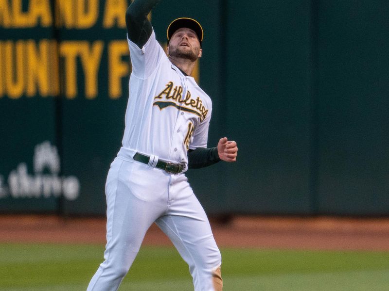 May 30, 2023; Oakland, California, USA;  Oakland Athletics right fielder Seth Brown (15) fields a fly ball against the Atlanta Braves during the sixth inning at Oakland-Alameda County Coliseum. Mandatory Credit: Neville E. Guard-USA TODAY Sports